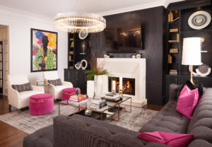 living room with pink decor and black wall