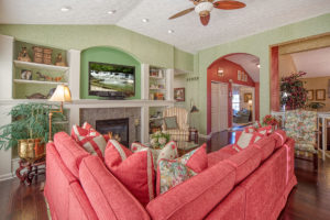 living room with pink sectional couch